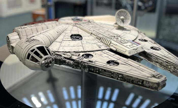 The Millennium Falcon exhibition showing a scale model of the iconic Star Wars starship